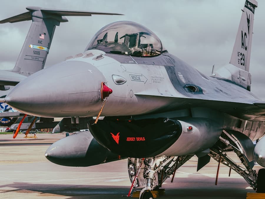An f-16 fighter jet is parked.